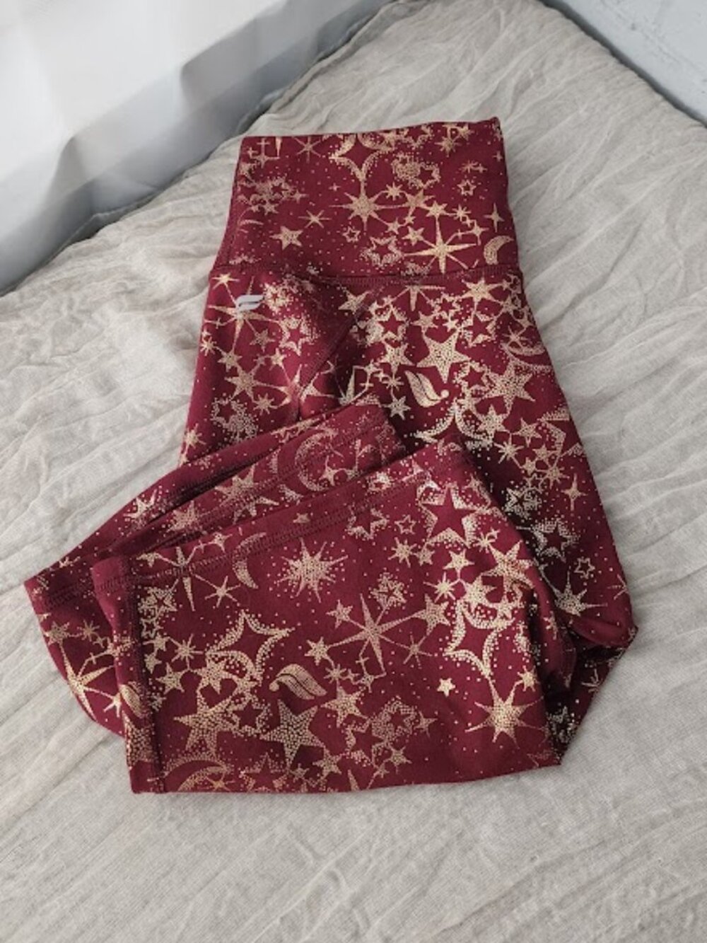 Fabletics PowerHold Celestial Biker Shorts Burgundy Gold Stars M